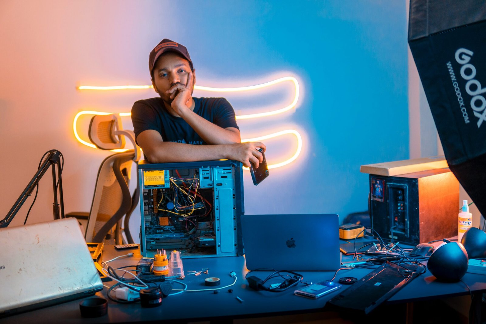A man sitting in front of a laptop computer